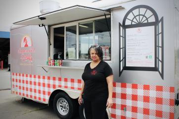 Southern girl delights owner, dorothy golson stands with her food cart.