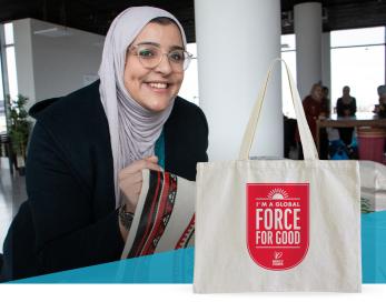 Raneem and a mercy corps tote bag