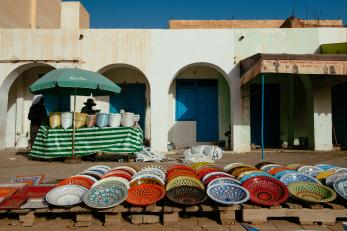 Dishes laid out for sale on a street in tunisia
