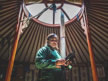 Woman in mongolia with a drone