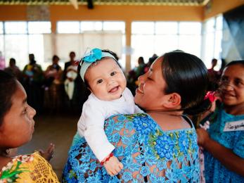 Woman with smiling baby in guatemala