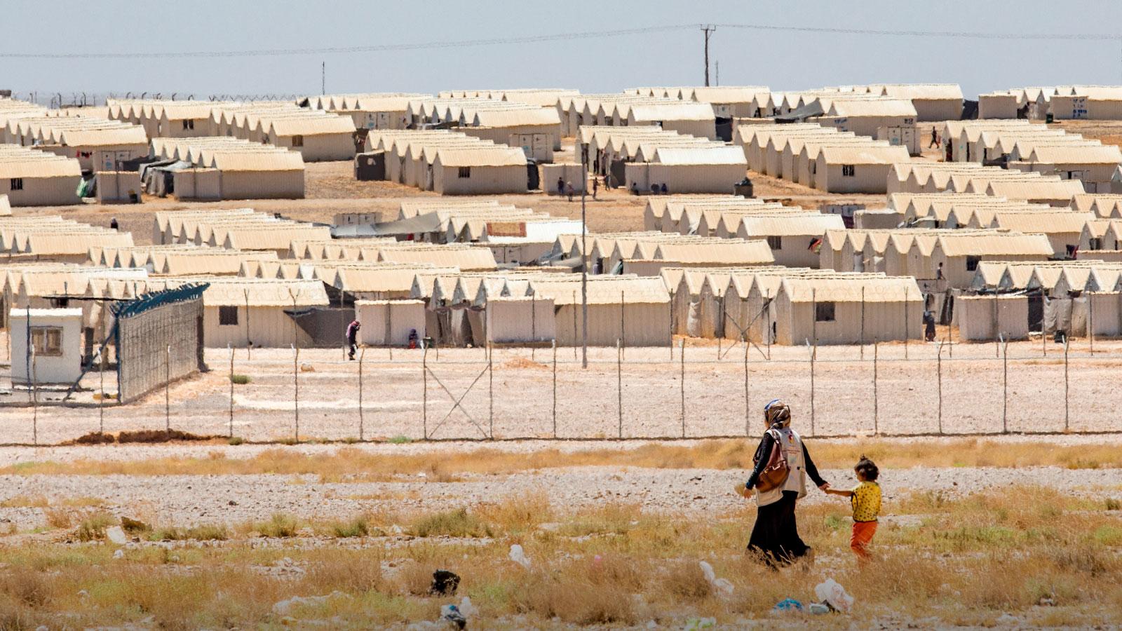 A mother and daughter approach Azraq refugee camp in Jordan. More than 1.6 million Syrian refugees are living in Jordan and Lebanon, where Mercy Corps has been addressing their needs since 2012.