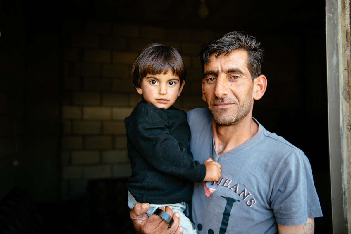 A man holding a young child