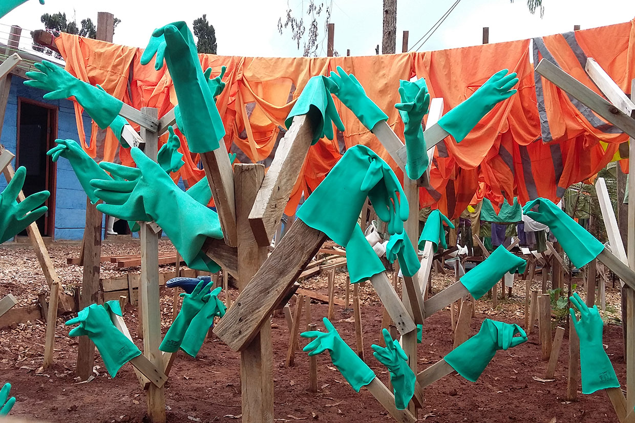 Image: Turquoise rubber gloves are hanging to dry after being sanitized