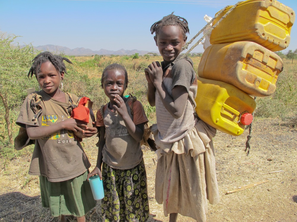 From a young age, girls in Ethiopia are expected to gather wood, fetch water and shop for the family’s food. It can take all day to collect enough food and water for one meal, so there is often no time for school. Photo: Joni Kabana for Mercy Corps