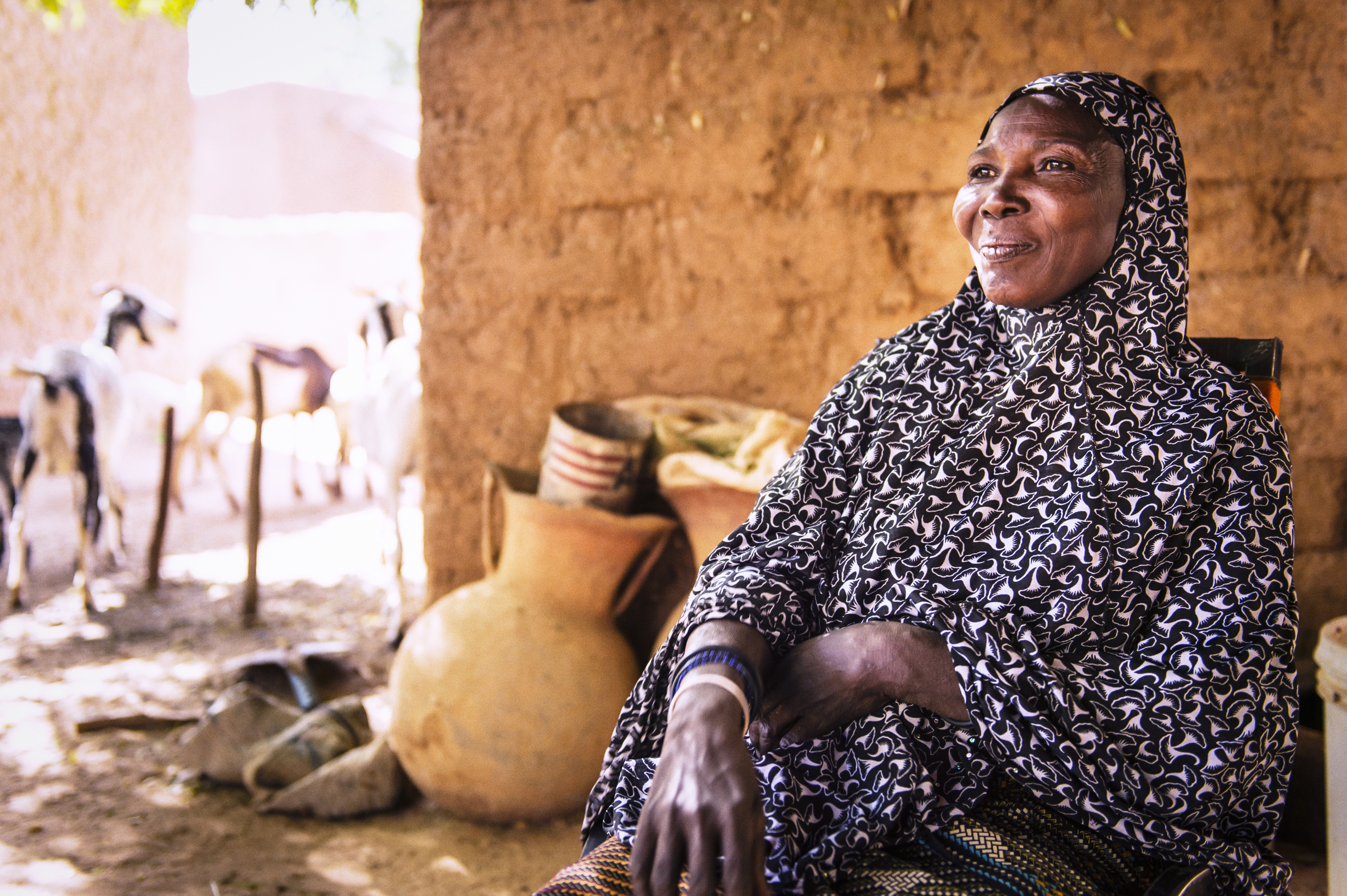 A woman in Niger smiling and looking into the distance