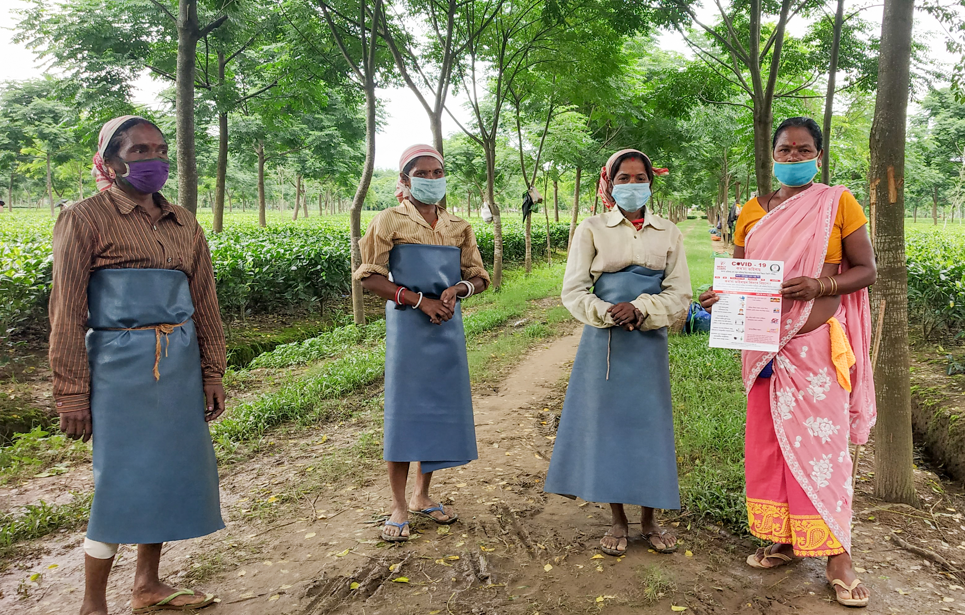 Tea industry workers standing together.