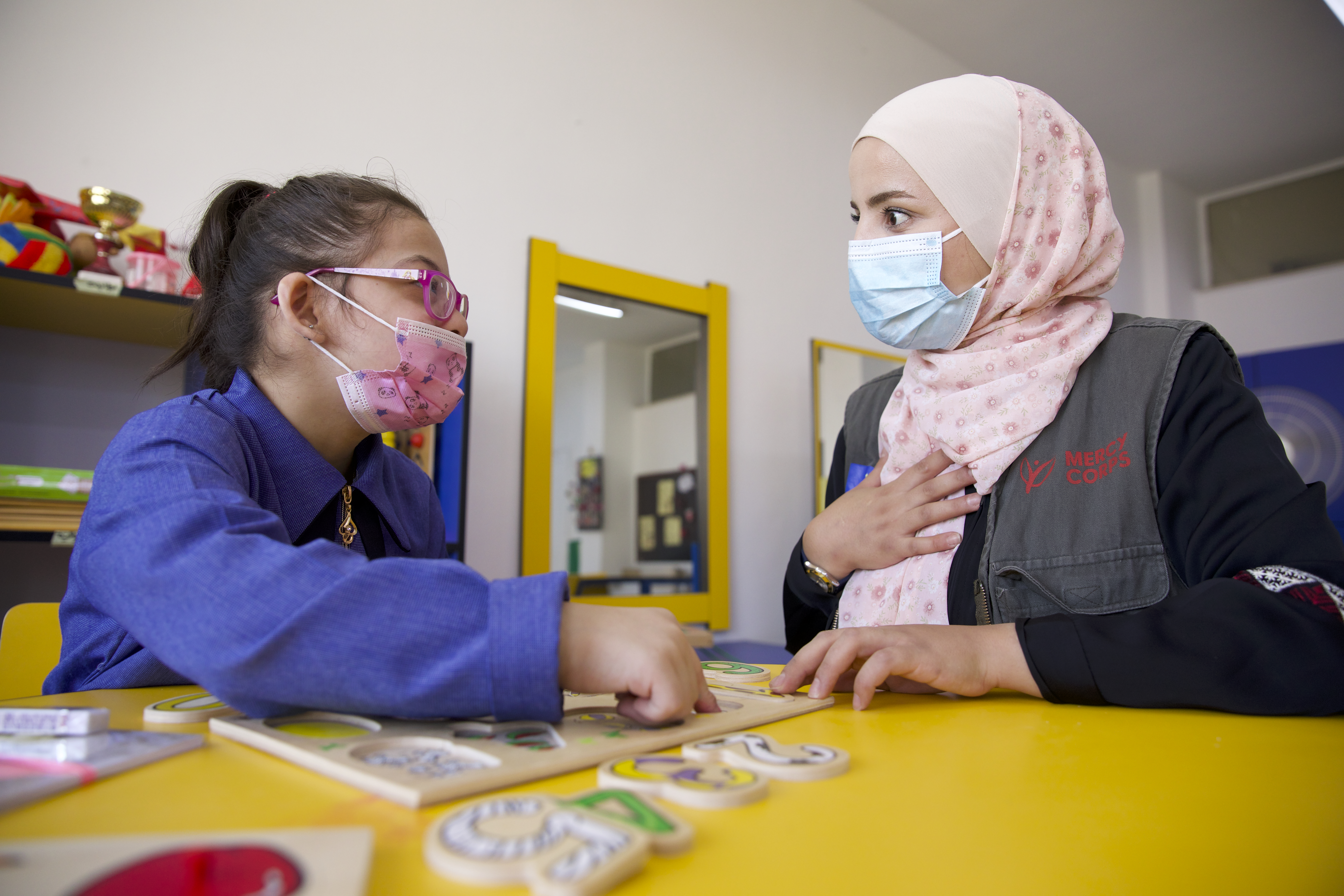 A student and an instructor working together.