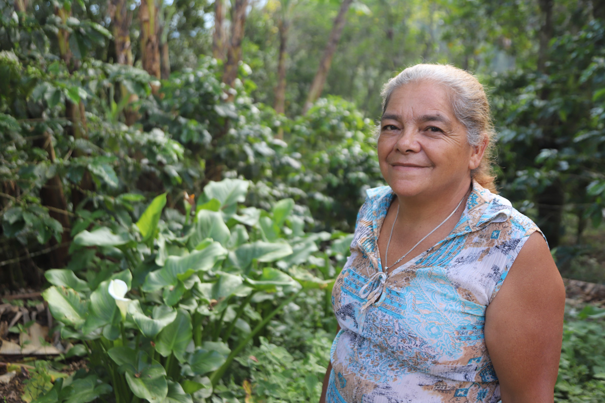 An image of Rosario Rodriguez, a second-generation coffee producer who helps lead her farmer co-op.