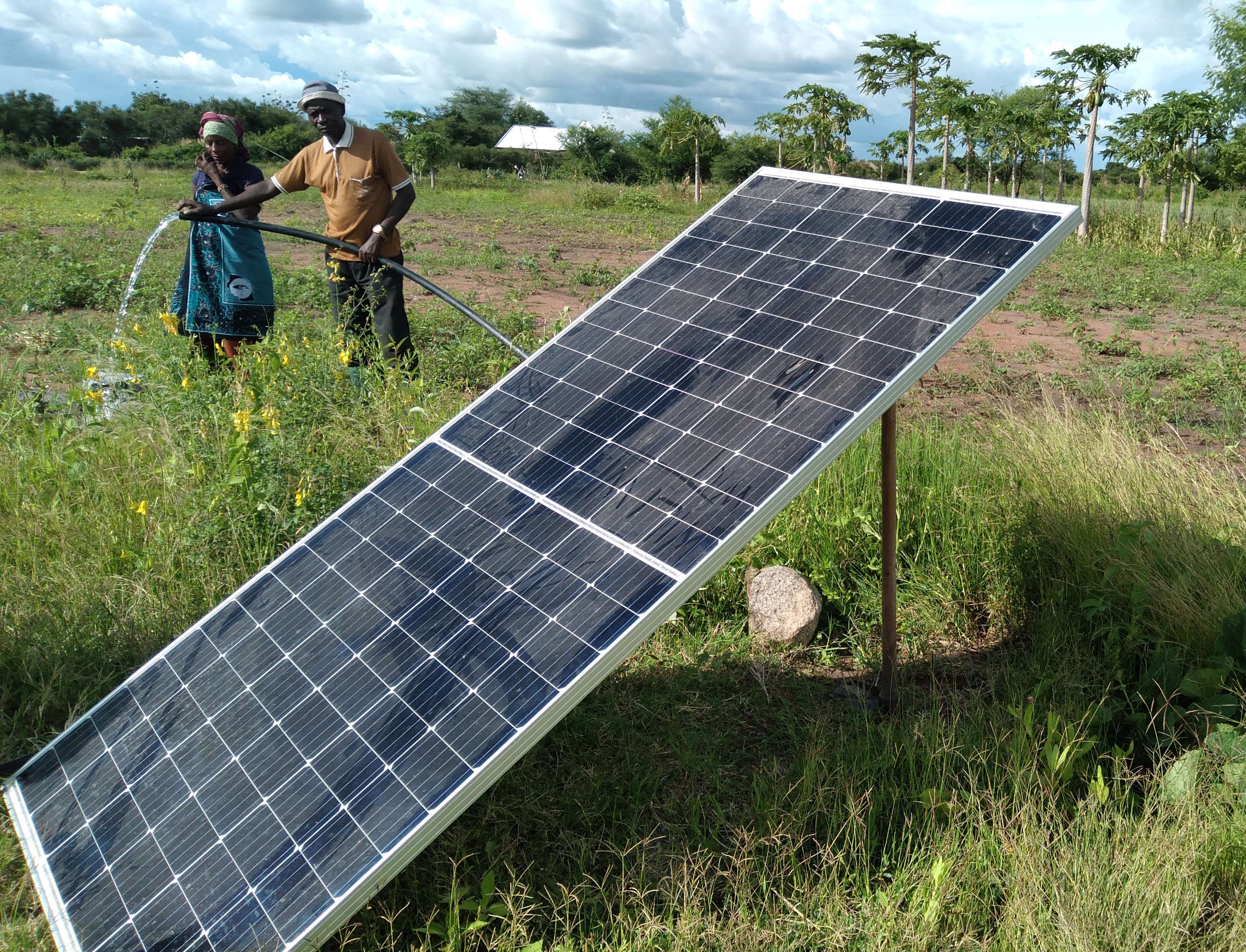 A subsistence farmer using a a solar water pump.