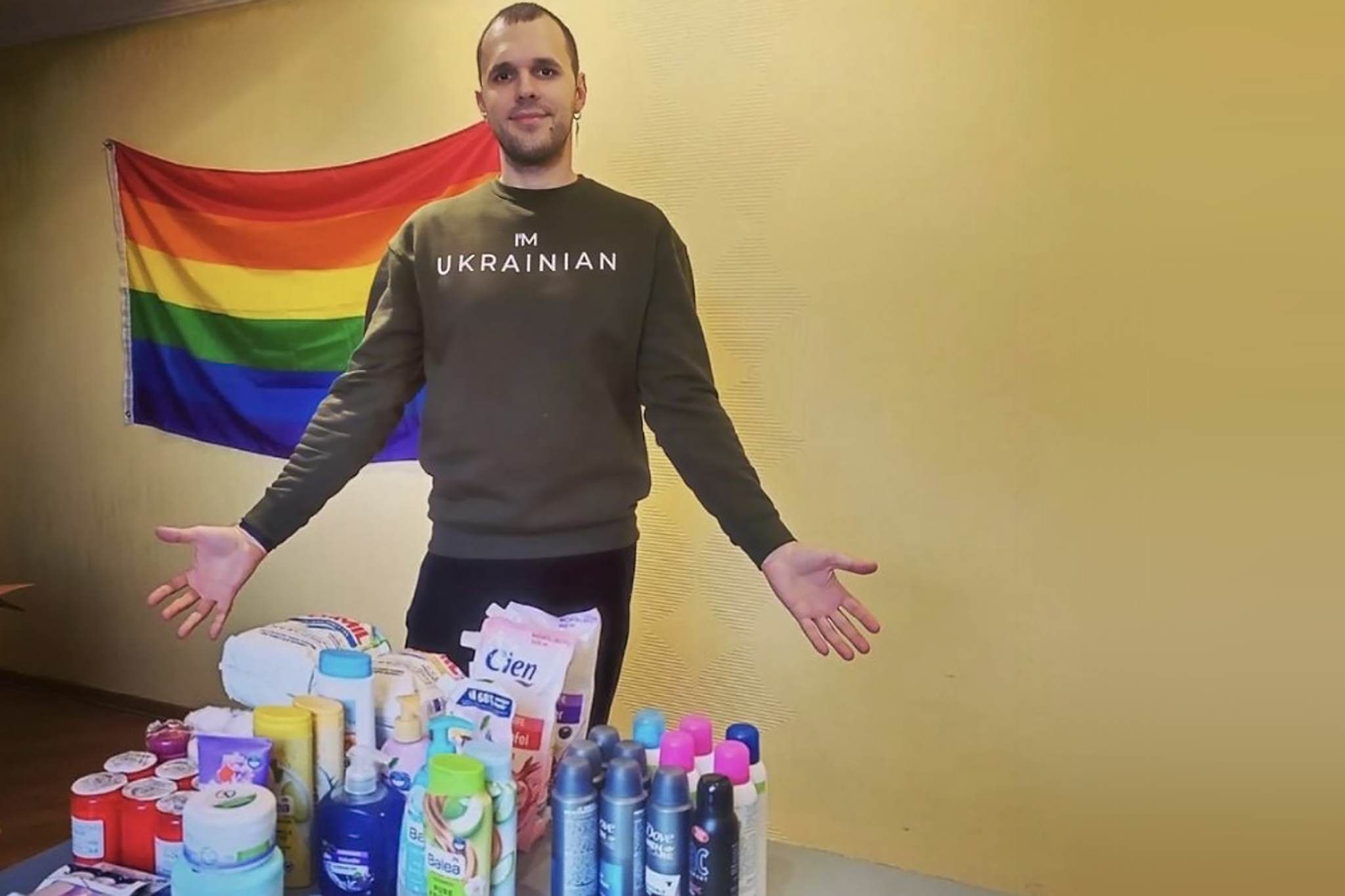 A person displaying personal care and hygiene supplies for displaced persons.