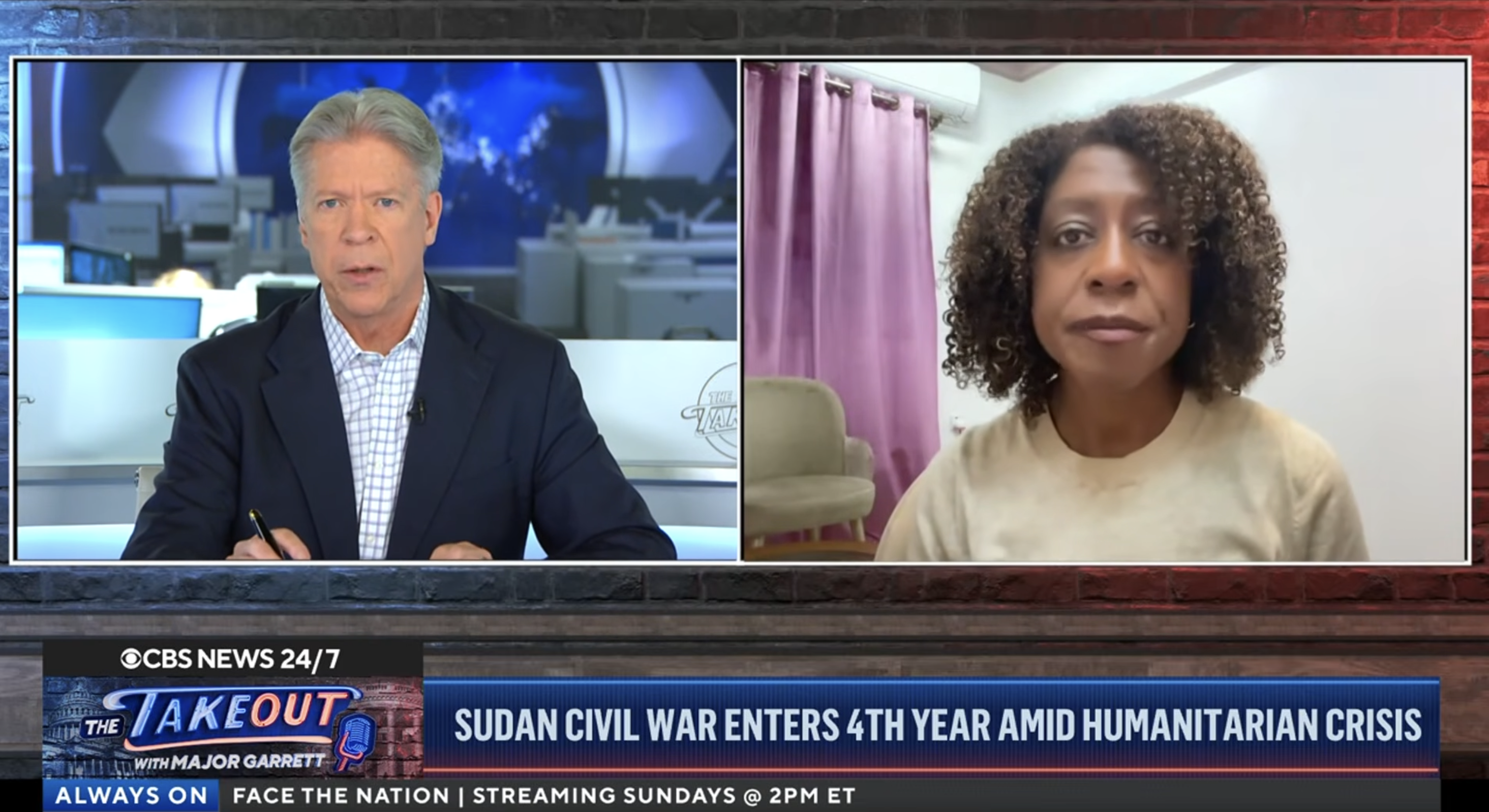 Screenshot of mercy corps ceo with cbs journalist during tv interview..