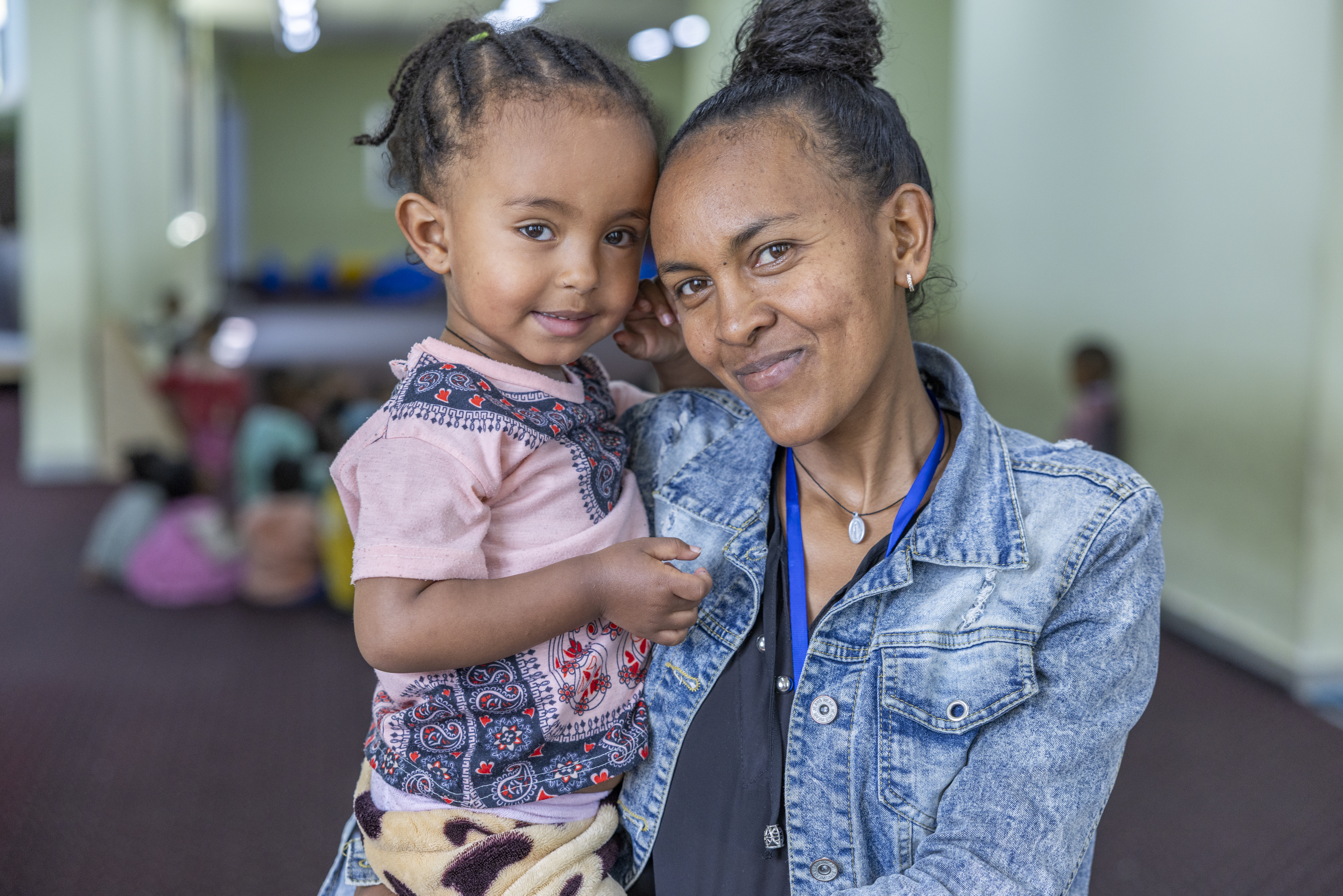 Ethiopian mother and daughter smiling together.