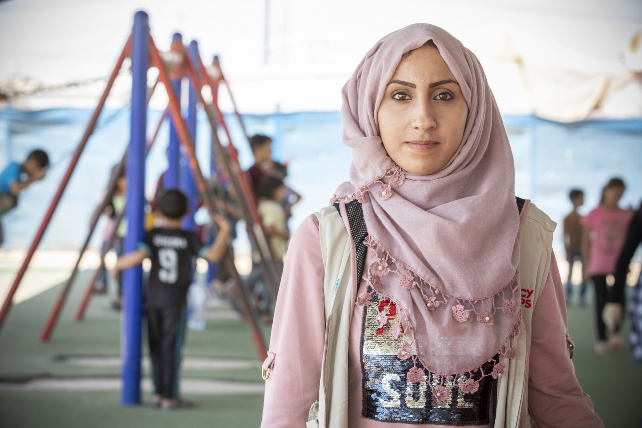 Image: Woman in Jordan wearing a pink scarf