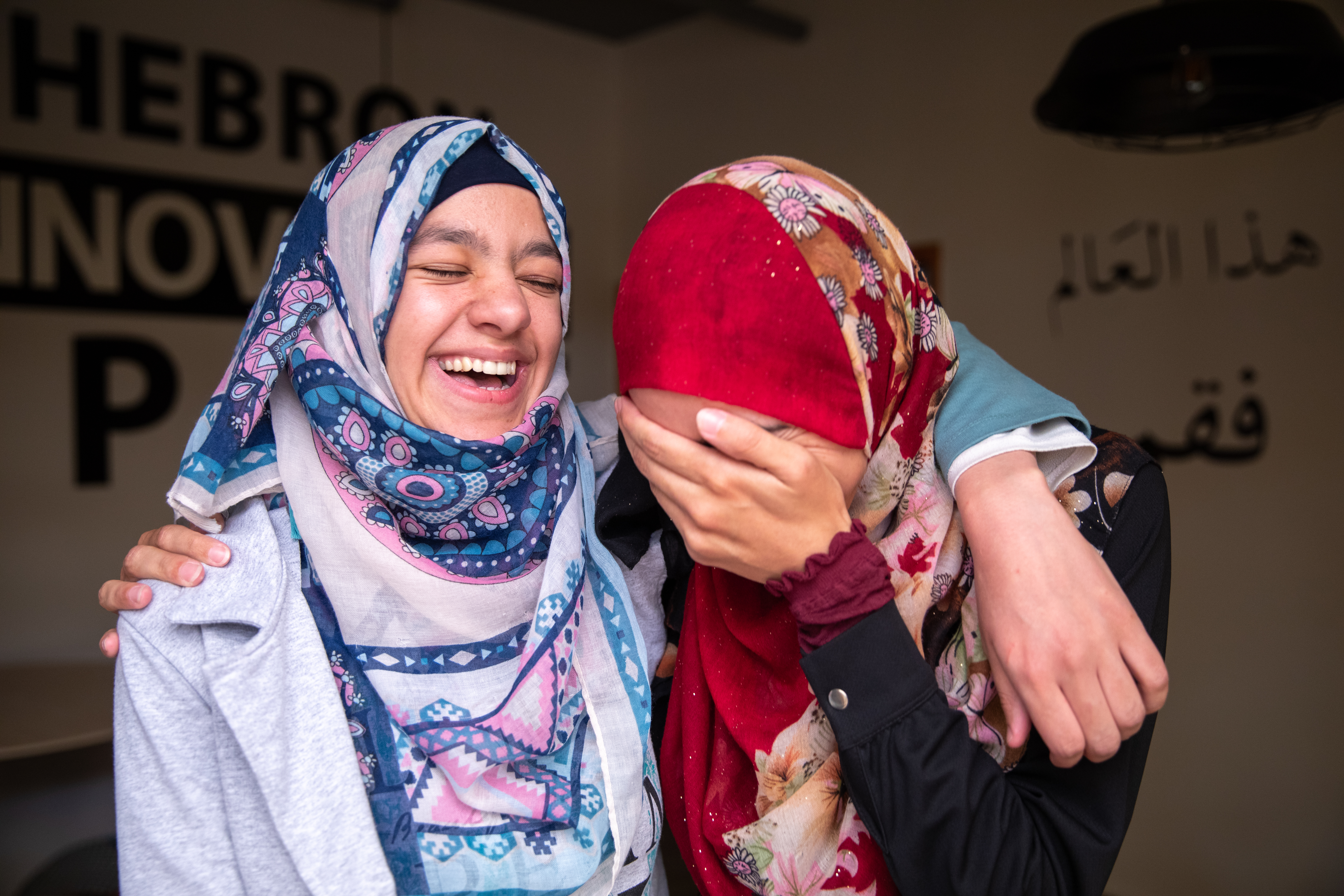 Two friends in Palestine laughing together