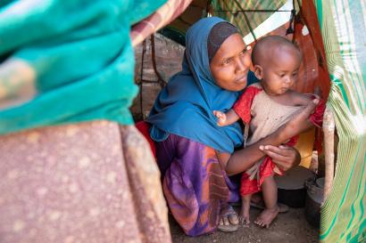 Somalian mother and child in tent.
