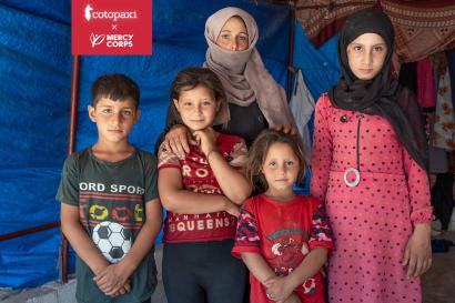 Syrian family inside a tent.