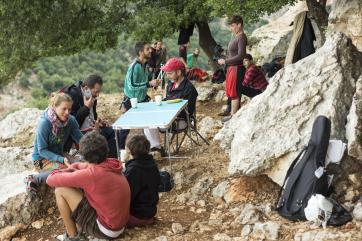 Group of participants resting and chatting outside