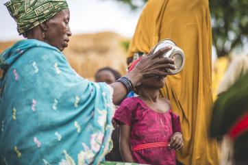 Feeding porridge to a child