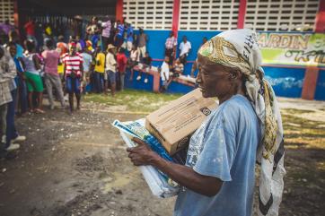 Haitian woman with aid package
