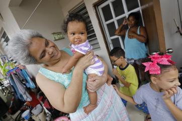 Marisal, 47, holds her five-month old granddaughter jeishalee.