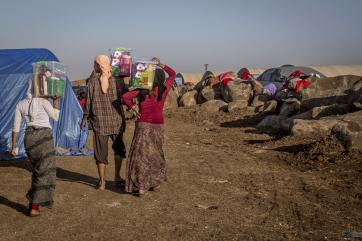 Refugees walking down a dirt road