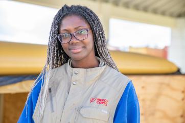 Mercy corps employee in a warehouse.