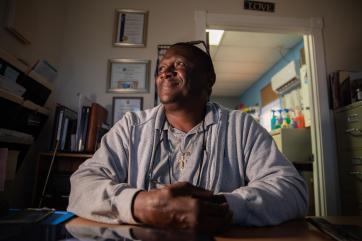 A person sits at a desk in grand bahama.