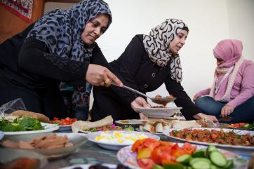 People serving food in jordan. 