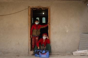 Patients receive home isolation kits from mercy corps in a covid-19 isolation center in jumla.