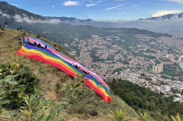Mercy corps colombia partnered with local organizations, caribe afirmativo and casa diversa, to unveil the trans and gay pride flag overlooking medellín in 2021. 