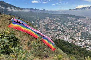 Mercy corps colombia partnered with local organizations, caribe afirmativo and casa diversa, to unveil the trans and gay pride flag overlooking medellín in 2021.