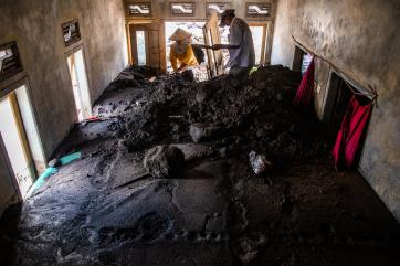 The inside of a home half-buried in ash near mt. semeru after its most recent eruption.