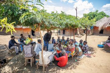 30 year old festo james, the vice chairperson of ala-zabu savings group attends one of the group meetings.