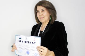Woman holding a certificate