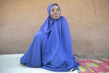 A herder sits in the shade of a mudbrick house in their settlement in kodomun-upper.