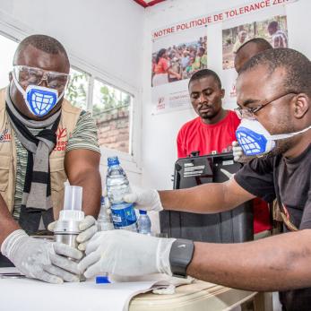 Congolese men working in a laboratory.