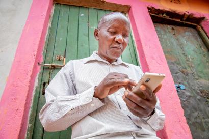 Kenyan man on his smartphone