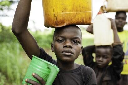 Boys fetching water in car