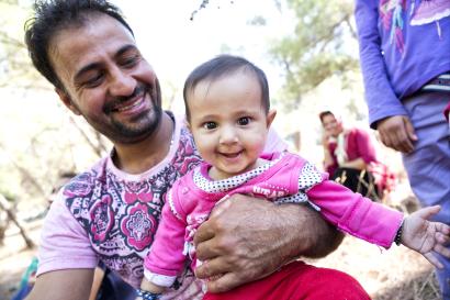 Man holding his baby in greece