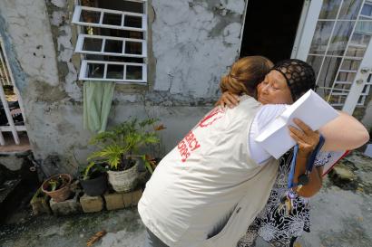 A woman hugging a mercy corps team member in puerto rico