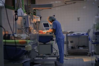 A nurse treats a newborn in a maternal and children’s hospital intensive care unit.