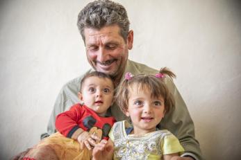 Ahmad with his granddaughters