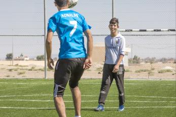 Two boys playing soccer