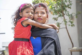 Woman holding a young girl in nepal