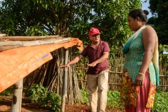 Mercy corps' agriculture specialist with santu