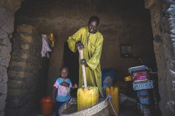 Badamasi pictured next to a small child