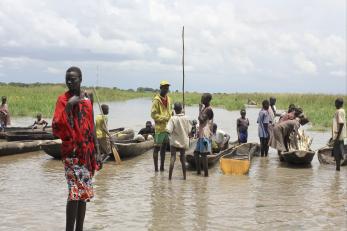 People gathering near boats