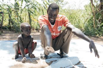 David pictured with a young child