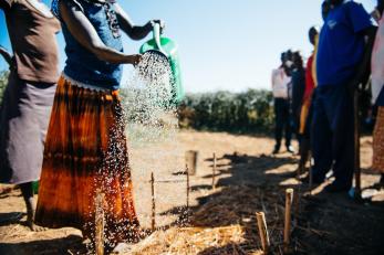 Woman pouring water from a watering can